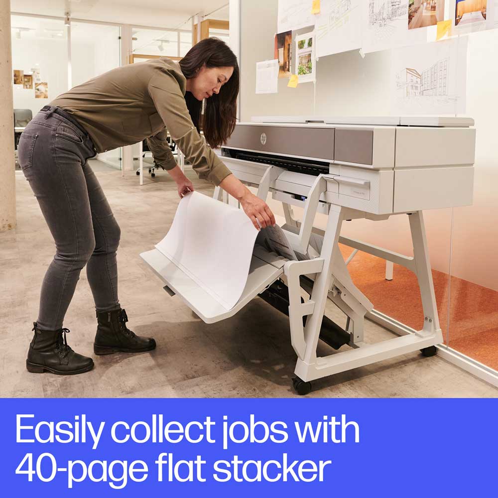 HP DesignJet XT950 annotated image of a printer with a user collecting large-format prints using the built-in 40-page flat stacker in a modern office workspace.